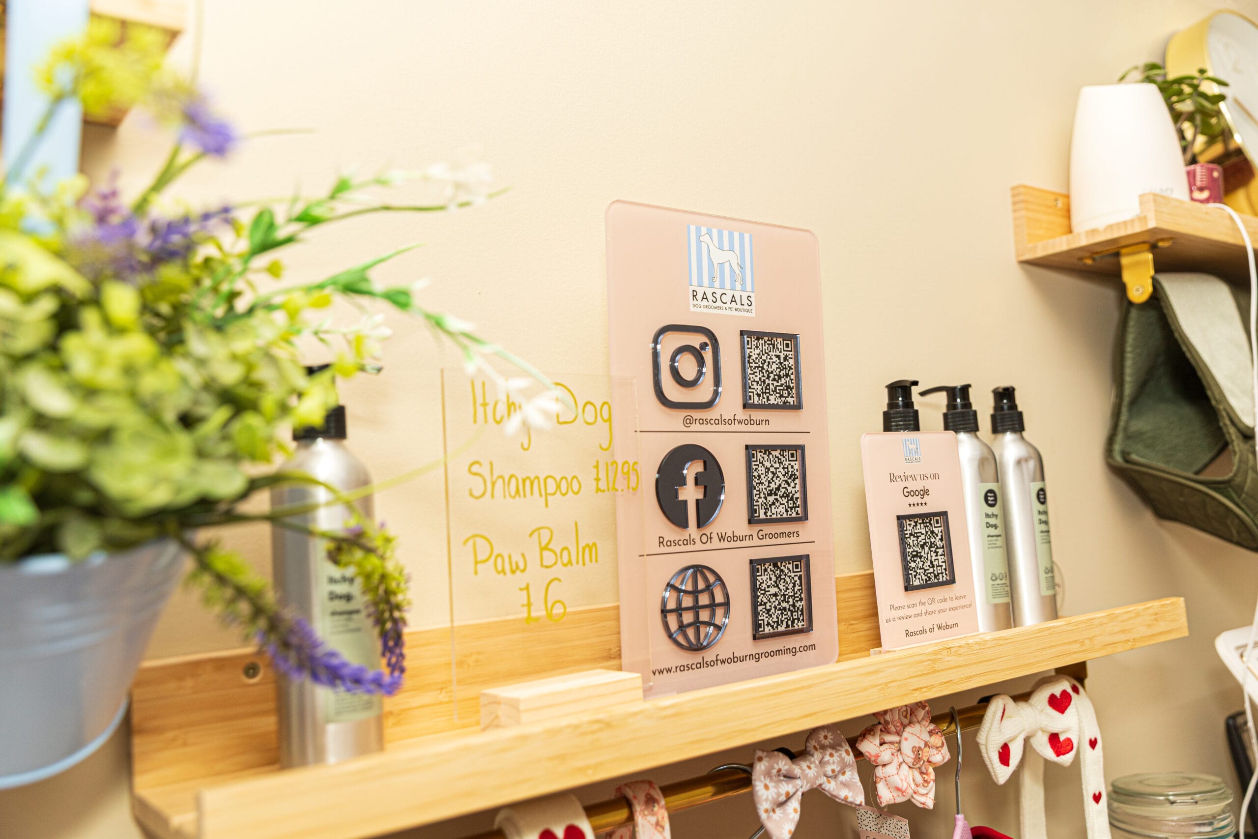 Social media QR codes on display in the salon Social media QR codes on display in the salon